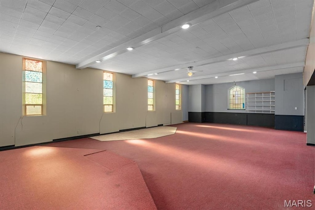 209 S Montgomery St, Gillespie, IL 62033 - spare room featuring carpet flooring, healthy amount of natural light, a ceiling fan, and beam ceiling