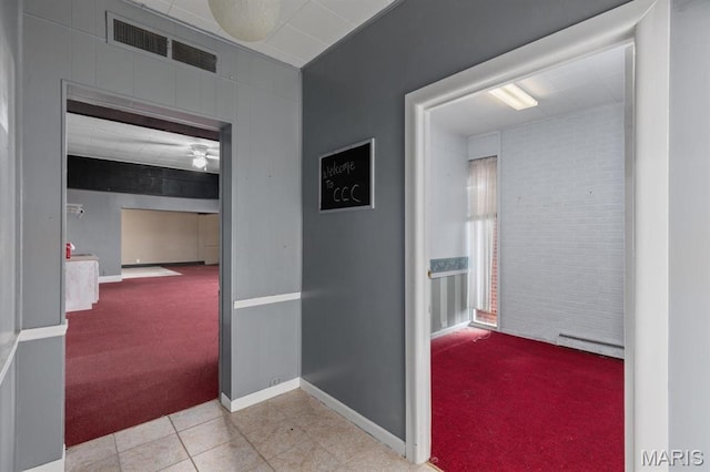 209 S Montgomery St, Gillespie, IL 62033 - hallway with carpet flooring, a baseboard heating unit, tile patterned flooring, and baseboards