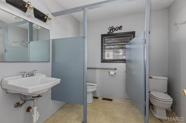 209 S Montgomery St, Gillespie, IL 62033 - bathroom featuring toilet, tile patterned floors, and a sink
