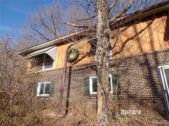 6045 Ozark Dr, High Ridge, MO 63049 - view of property exterior featuring brick siding