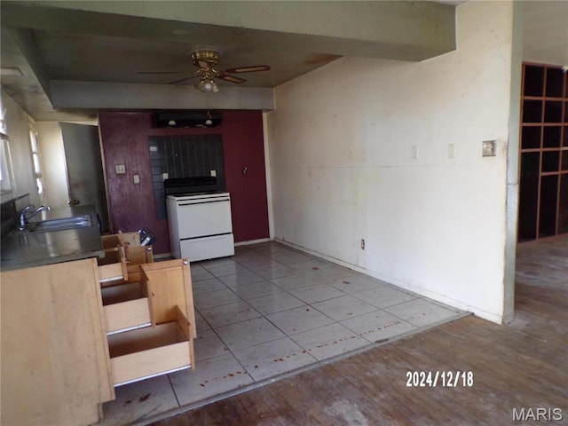 6045 Ozark Dr, High Ridge, MO 63049 - kitchen featuring white range with electric stovetop, ceiling fan, and tile patterned flooring