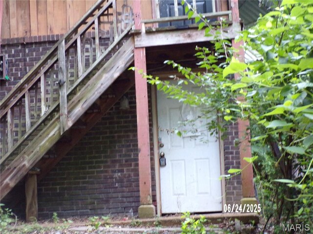 6045 Ozark Dr, High Ridge, MO 63049 - doorway to property featuring brick siding