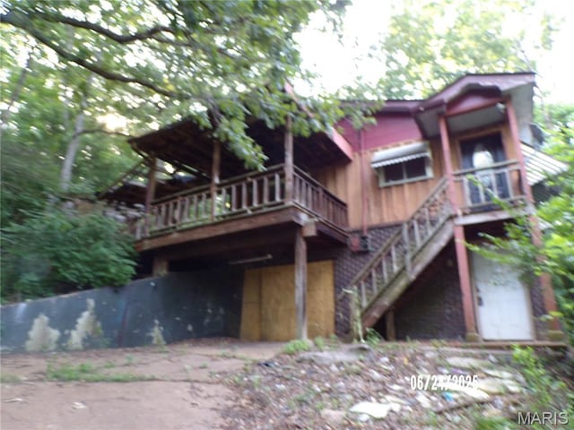 6045 Ozark Dr, High Ridge, MO 63049 - rear view of house with a deck and stairway