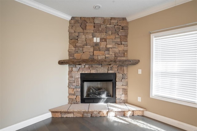 382 Golden Ln, Poplar Bluff, MO 63901 - detailed view of crown molding, baseboards, a stone fireplace, and wood finished floors