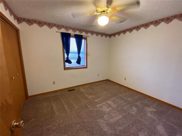 16340 Caldwell Ln, Dixon, MO 65459 - unfurnished bedroom featuring a textured ceiling, carpet flooring, baseboards, ceiling fan, and a closet