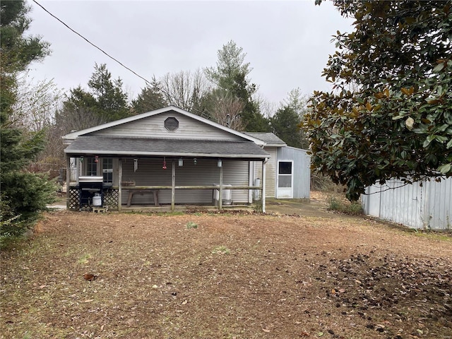 16340 Caldwell Ln, Dixon, MO 65459 - back of house featuring covered porch and roof with shingles
