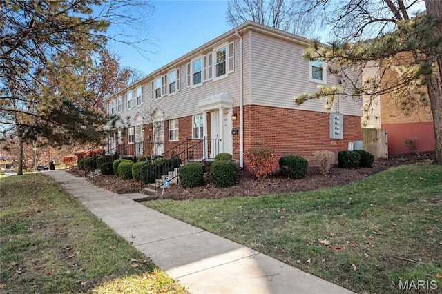 1508 Swallow Dr, Saint Louis, MO 63144 - view of front of home with brick siding and a front yard