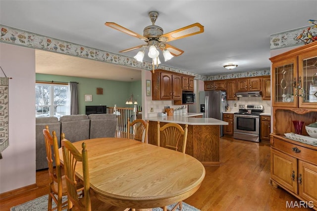 807 W Miller Dr, Staunton, IL 62088 - dining room featuring light wood-type flooring and a ceiling fan