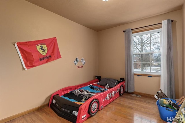 807 W Miller Dr, Staunton, IL 62088 - bedroom with wood finished floors and baseboards