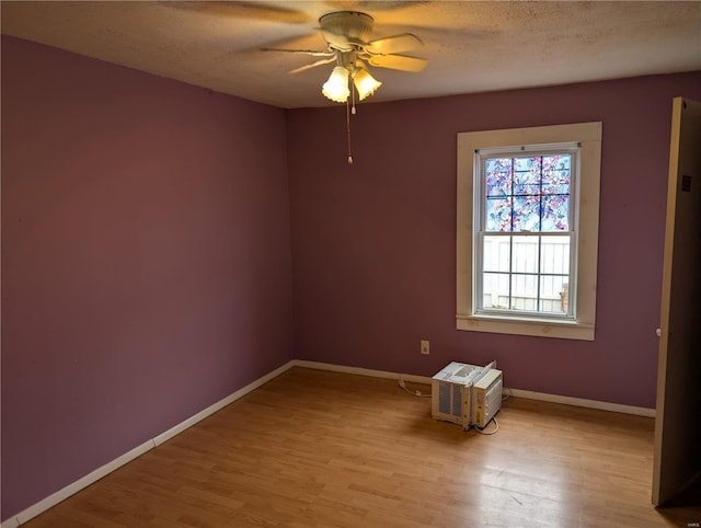 205 Fisher Ave, Sawyerville, IL 62085 - empty room featuring light wood-style floors, baseboards, a ceiling fan, and a textured ceiling