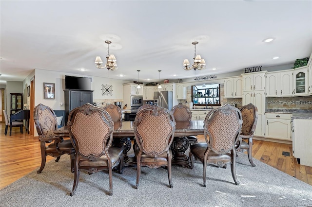 291 Deer Run Acres A, Williamsville, MO 63967 - dining area with a chandelier, light wood-type flooring, and recessed lighting