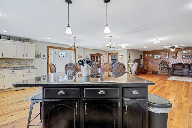 291 Deer Run Acres A, Williamsville, MO 63967 - kitchen with a chandelier, open floor plan, white cabinets, black electric stovetop, and dark cabinets