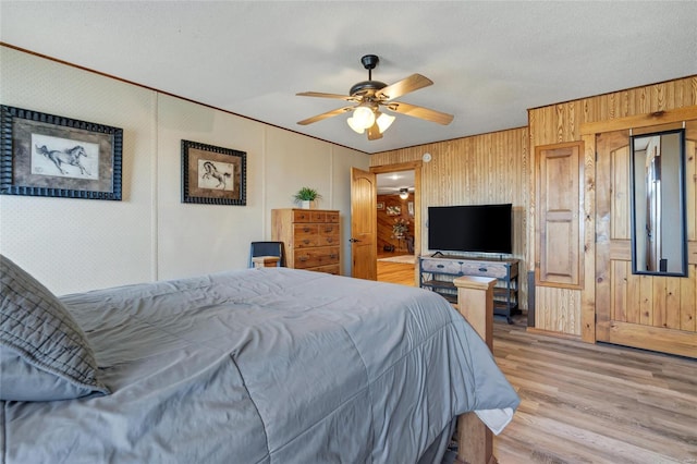 291 Deer Run Acres A, Williamsville, MO 63967 - bedroom with wood finished floors, wooden walls, ornamental molding, and ceiling fan