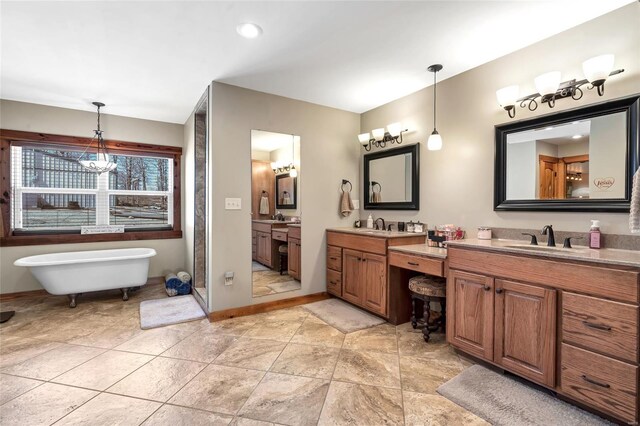 291 Deer Run Acres A, Williamsville, MO 63967 - full bath featuring two vanities, a freestanding tub, baseboards, and recessed lighting