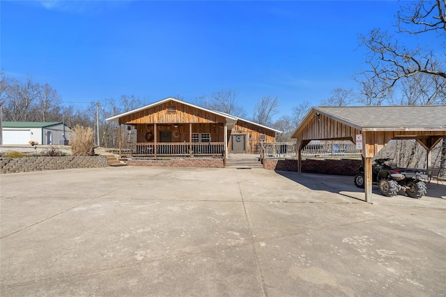 291 Deer Run Acres A, Williamsville, MO 63967 - rustic home with covered porch, board and batten siding, a carport, and driveway