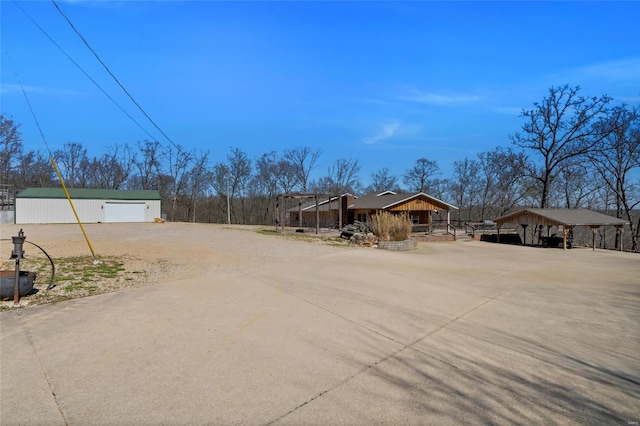 291 Deer Run Acres A, Williamsville, MO 63967 - view of yard with driveway, an outdoor structure, and a garage