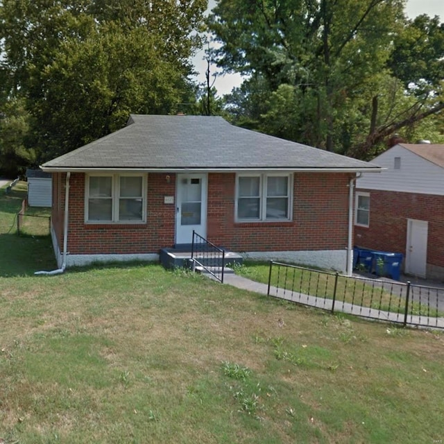 4610 Seattle St, Saint Louis, MO 63121 - view of front facade with brick siding and roof with shingles