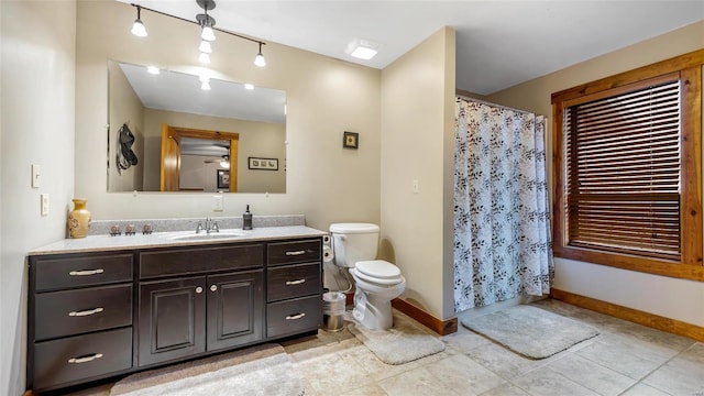 302 Deer Run Acres A, Williamsville, MO 63967 - full bathroom featuring baseboards, toilet, vanity, tile patterned flooring, and curtained shower
