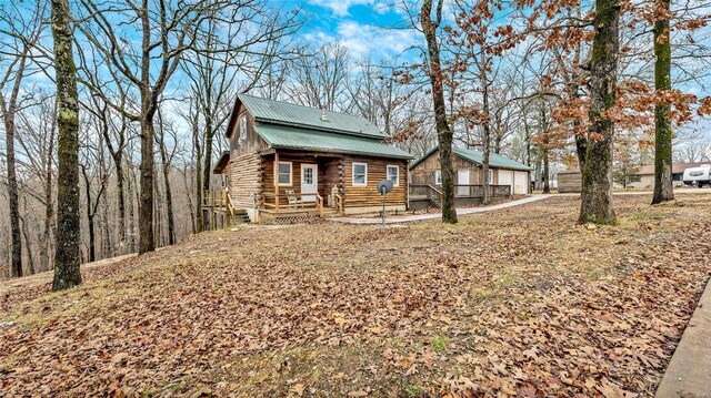 302 Deer Run Acres A, Williamsville, MO 63967 - view of front facade with log siding, a detached garage, and metal roof
