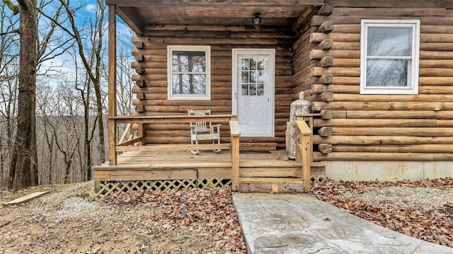 302 Deer Run Acres A, Williamsville, MO 63967 - doorway to property featuring log exterior and a wooden deck
