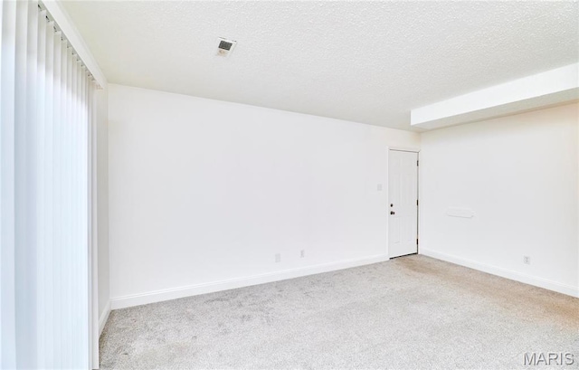 285 Mount Everest Dr, Fenton, MO 63026 - empty room featuring light carpet, a textured ceiling, and baseboards