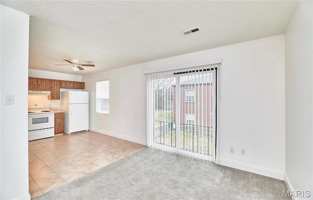 285 Mount Everest Dr, Fenton, MO 63026 - unfurnished living room with ceiling fan, baseboards, light carpet, a textured ceiling, and light tile patterned flooring