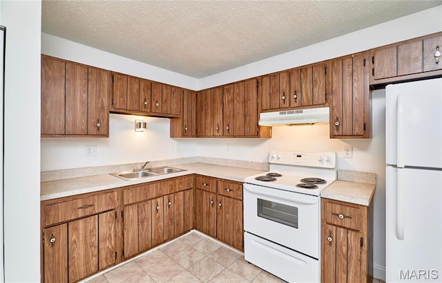 285 Mount Everest Dr, Fenton, MO 63026 - kitchen featuring under cabinet range hood, white appliances, a sink, brown cabinetry, and light countertops
