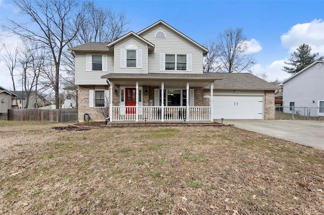 3520 Leming Ln, Jackson, MO 63755 - traditional-style house with covered porch, brick siding, driveway, and a garage