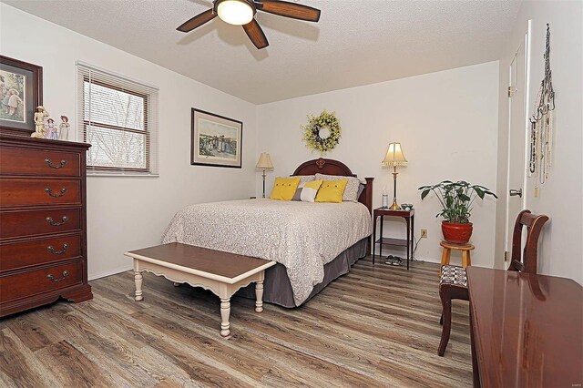 918 Susan St, Dexter, MO 63841 - bedroom with dark wood finished floors and ceiling fan
