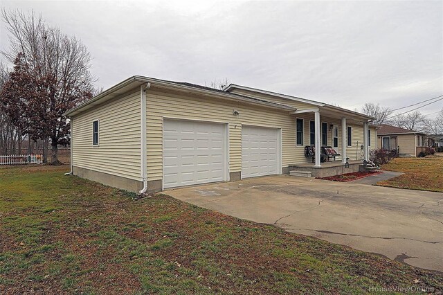 918 Susan St, Dexter, MO 63841 - view of front of home with a porch, a garage, and concrete driveway