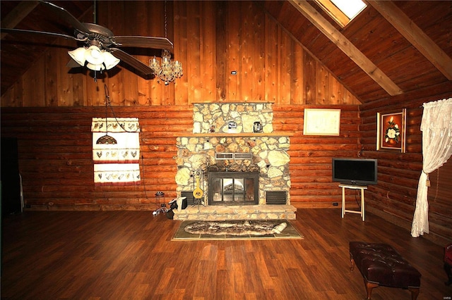 unfurnished living room featuring ceiling fan, a stone fireplace, wood finished floors, rustic walls, and wood ceiling