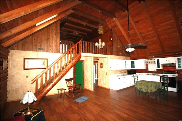 unfurnished living room with wood ceiling, high vaulted ceiling, beam ceiling, dark wood-style floors, and stairway