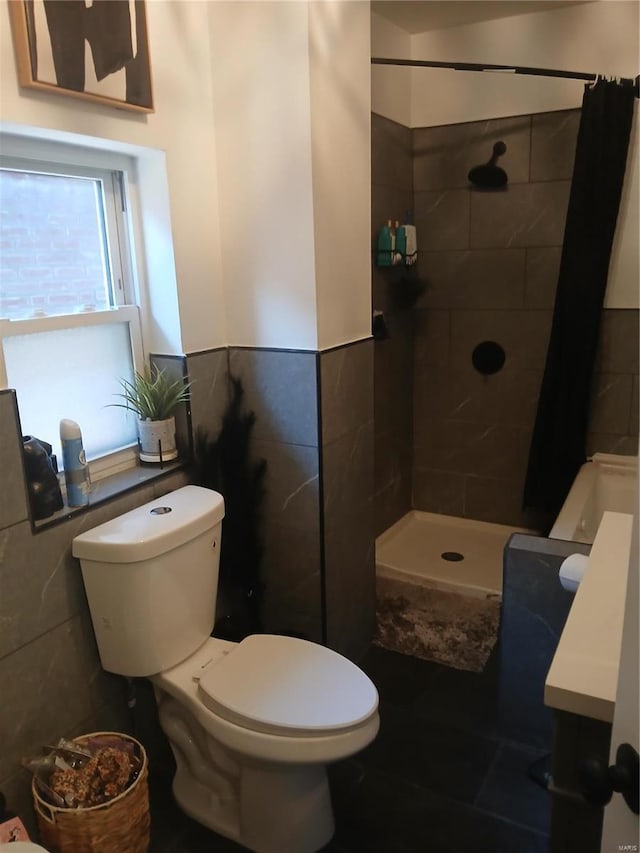 1018 N Hornsby, Saint Louis, MO 63147 - bathroom with tile walls, tiled shower, toilet, and wainscoting