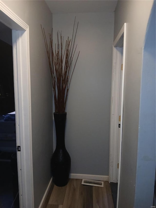 1018 N Hornsby, Saint Louis, MO 63147 - corridor featuring wood finished floors and baseboards