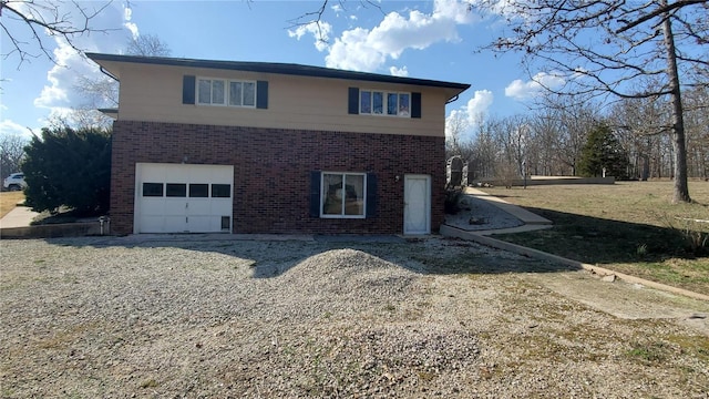 319 County Road 2270, Salem, MO 65560 - view of side of property with brick siding and a garage
