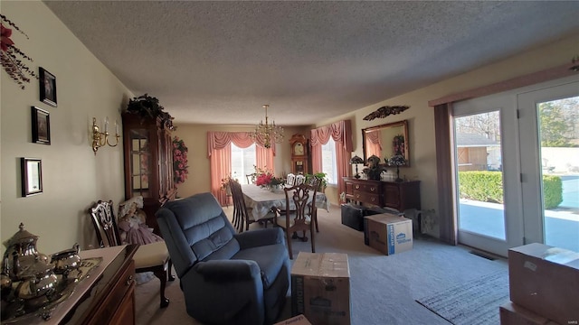 319 County Road 2270, Salem, MO 65560 - carpeted living area with a chandelier, a textured ceiling, and plenty of natural light