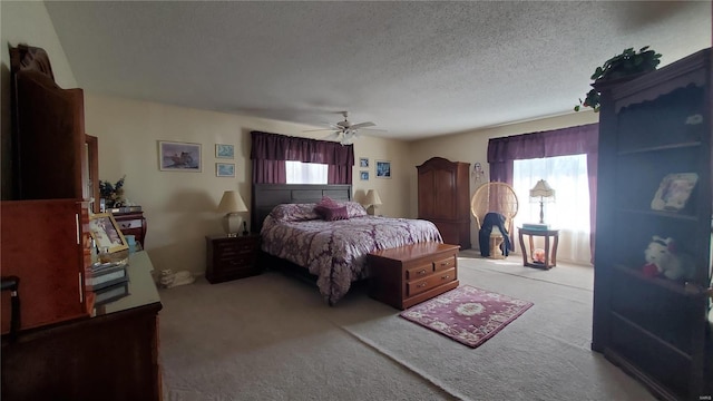 319 County Road 2270, Salem, MO 65560 - carpeted bedroom featuring multiple windows, a ceiling fan, and a textured ceiling