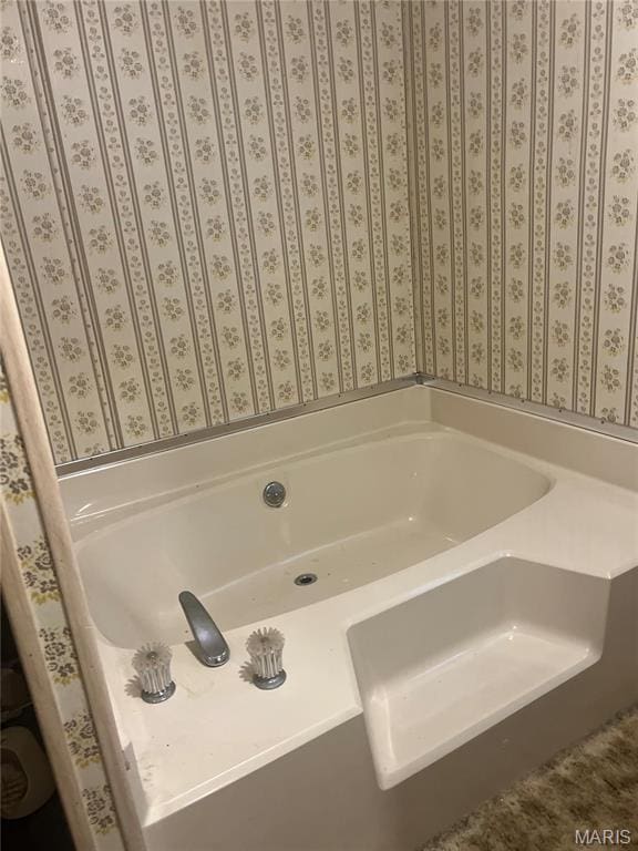 bathroom with a garden tub