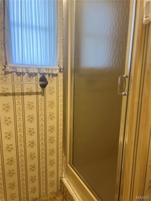 full bathroom featuring a shower stall