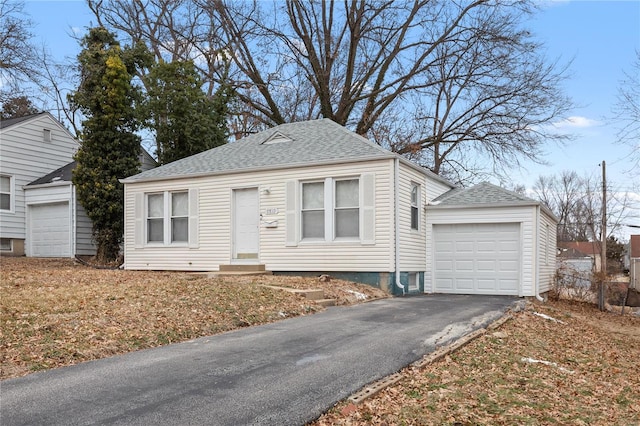 7719 Horatio Dr, Saint Louis, MO 63121 - view of front of home with driveway, roof with shingles, and entry steps