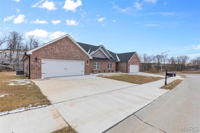 4 Creekside Way, Cape Girardeau, MO 63701 - view of front of home with driveway, an attached garage, and brick siding