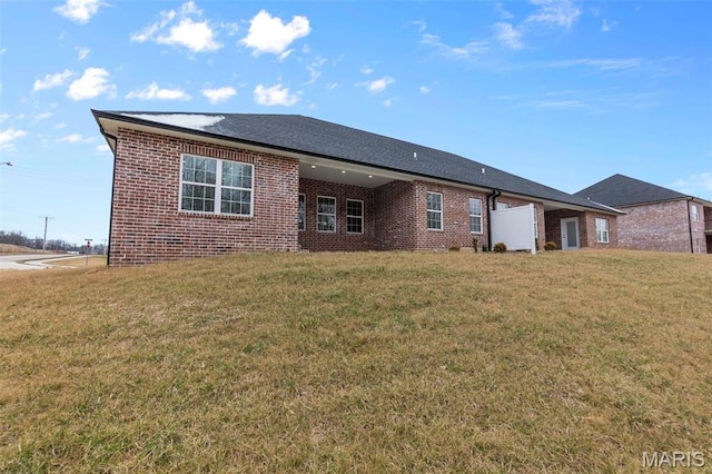4 Creekside Way, Cape Girardeau, MO 63701 - back of house featuring brick siding and a lawn