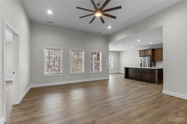 4 Creekside Way, Cape Girardeau, MO 63701 - unfurnished living room featuring ceiling fan, wood finished floors, and recessed lighting