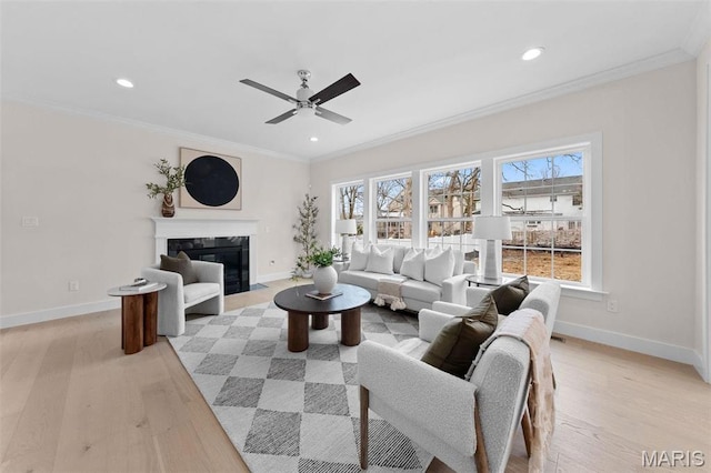 629 Simmons Ave, Saint Louis, MO 63122 - living room with baseboards, ceiling fan, recessed lighting, light wood-type flooring, and ornamental molding