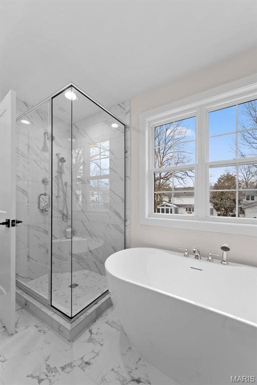 629 Simmons Ave, Saint Louis, MO 63122 - full bath featuring a soaking tub, a marble finish shower, and marble finish floors