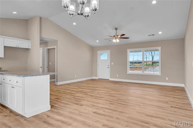 8 Bluebell Way, Jackson, MO 63755 - unfurnished living room with lofted ceiling, baseboards, light wood-style flooring, ceiling fan, and recessed lighting