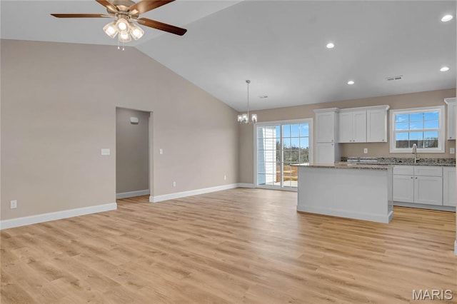 8 Bluebell Way, Jackson, MO 63755 - kitchen featuring white cabinetry, a center island, baseboards, a chandelier, and a sink