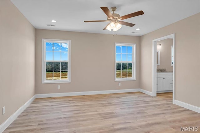8 Bluebell Way, Jackson, MO 63755 - unfurnished room with plenty of natural light, baseboards, light wood-style floors, and recessed lighting
