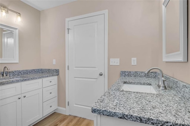 8 Bluebell Way, Jackson, MO 63755 - bathroom featuring vanity, wood finished floors, and baseboards