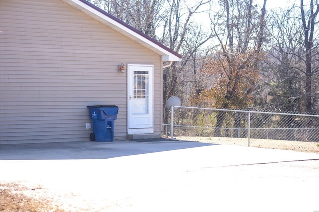 doorway to property with fence